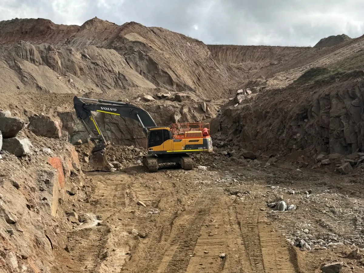 Volvo EC350DL excavator working at the quarry face